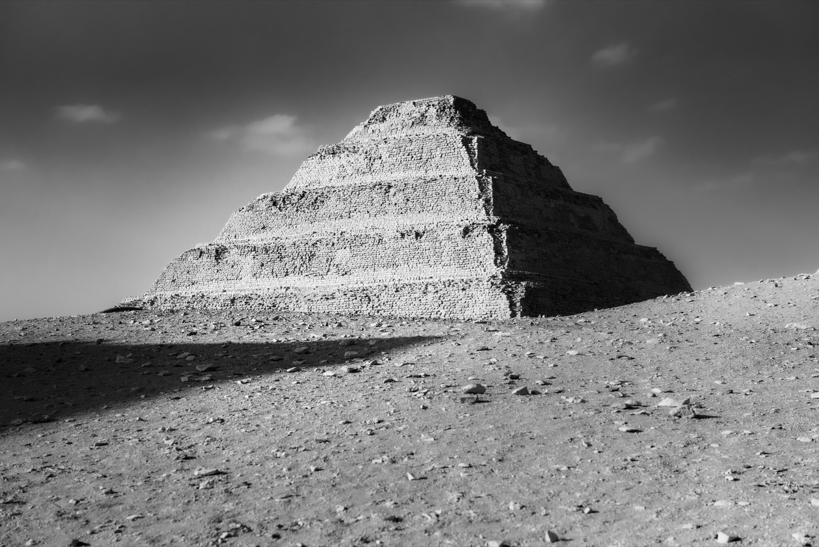 The Step Pyramid of Djoser at Saqqara, Egypt, in black and white.