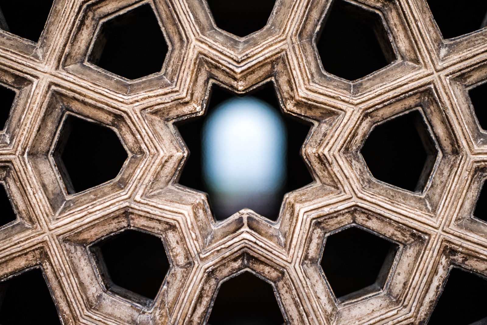 Detail of a carved stone lattice screen.