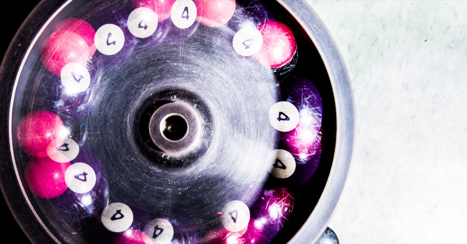 Long-exposure abstract of a spinning lottery cage.